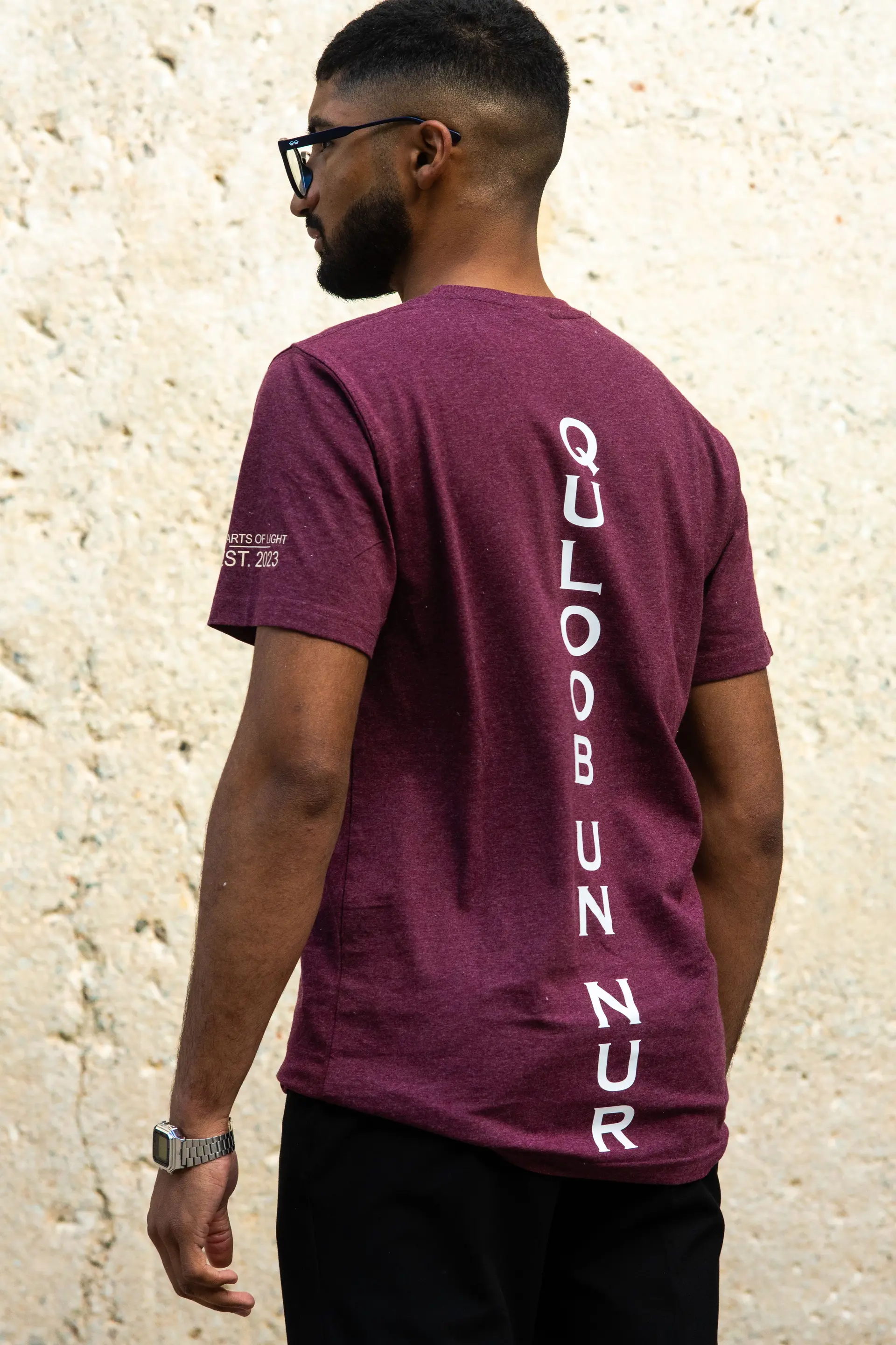 Maroon t-shirt from behind, showing the back print